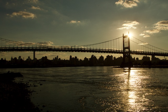 View of Hellsgate bridge, the Robert F. Kennedy Triborough Bridge and the NYC skyline from Astoria Park