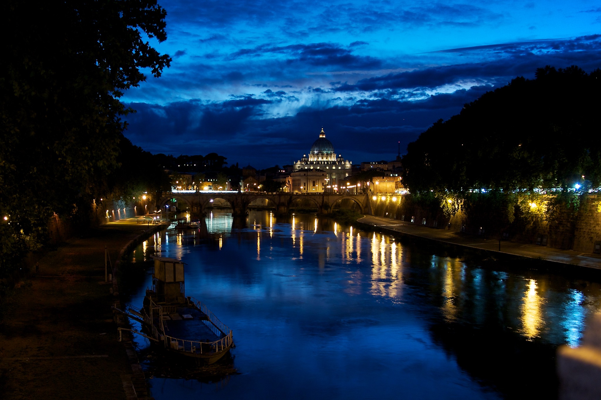 St. Peter's Cathedral at Night from the Tiber in Rome Italy